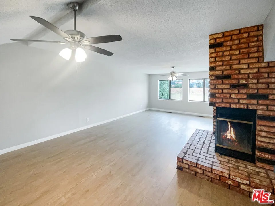 Original living room and brick fireplace before the remodel